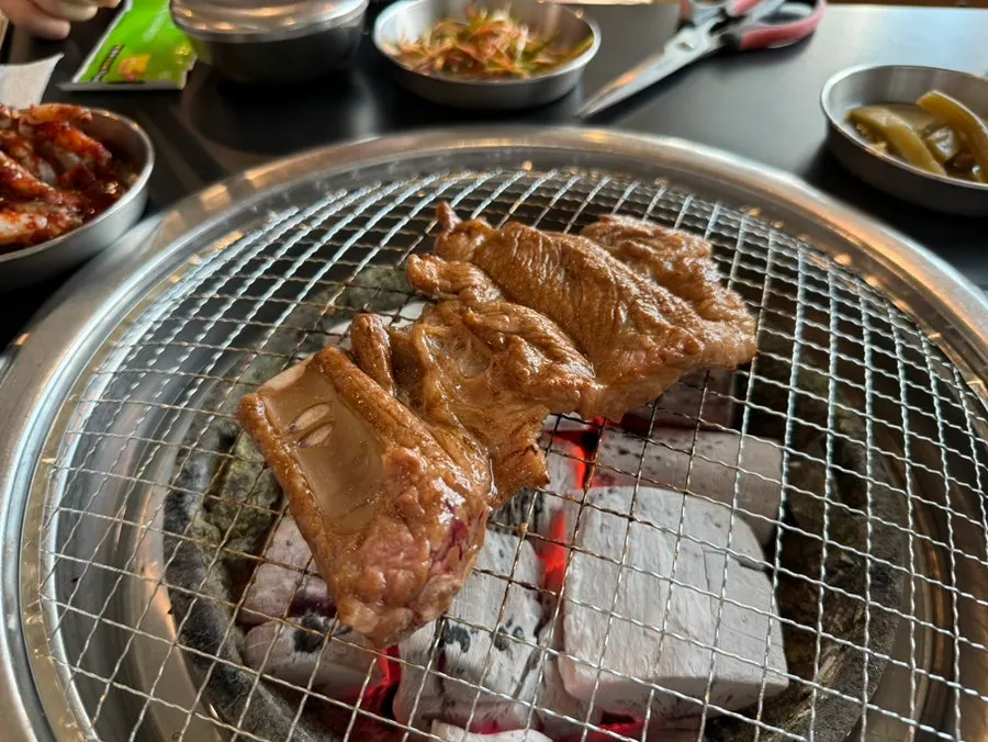 Thick grilled pork ribs with meat still on the bone
