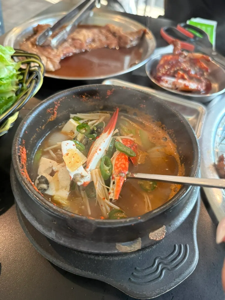 Broth of the miso soup with crab and corn snails