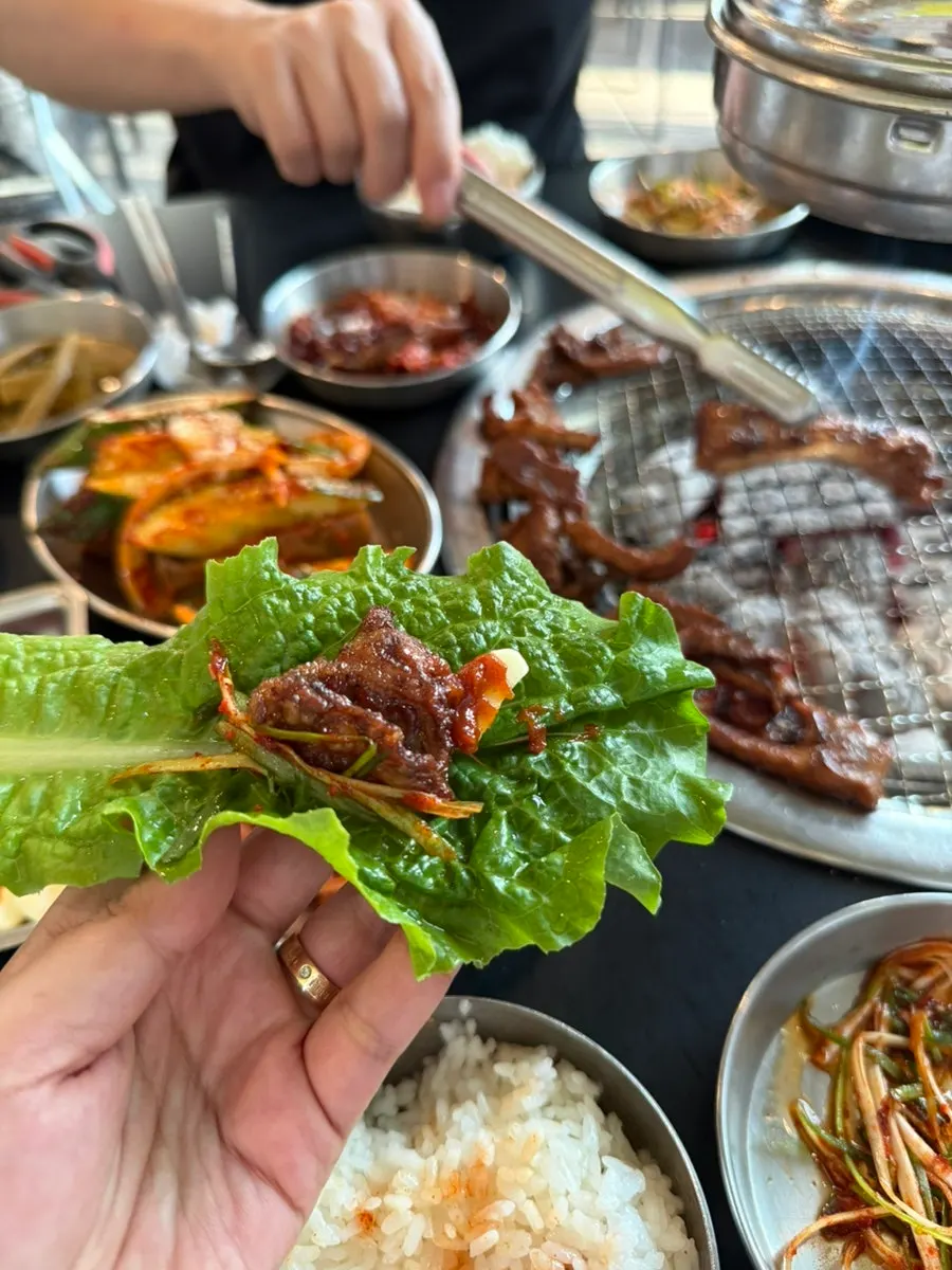 Final spread of pork ribs with rice and lettuce wraps