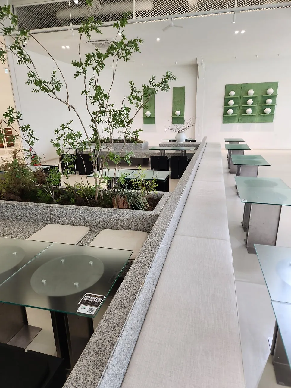 Second-floor seating at Chat Baker blended with plants