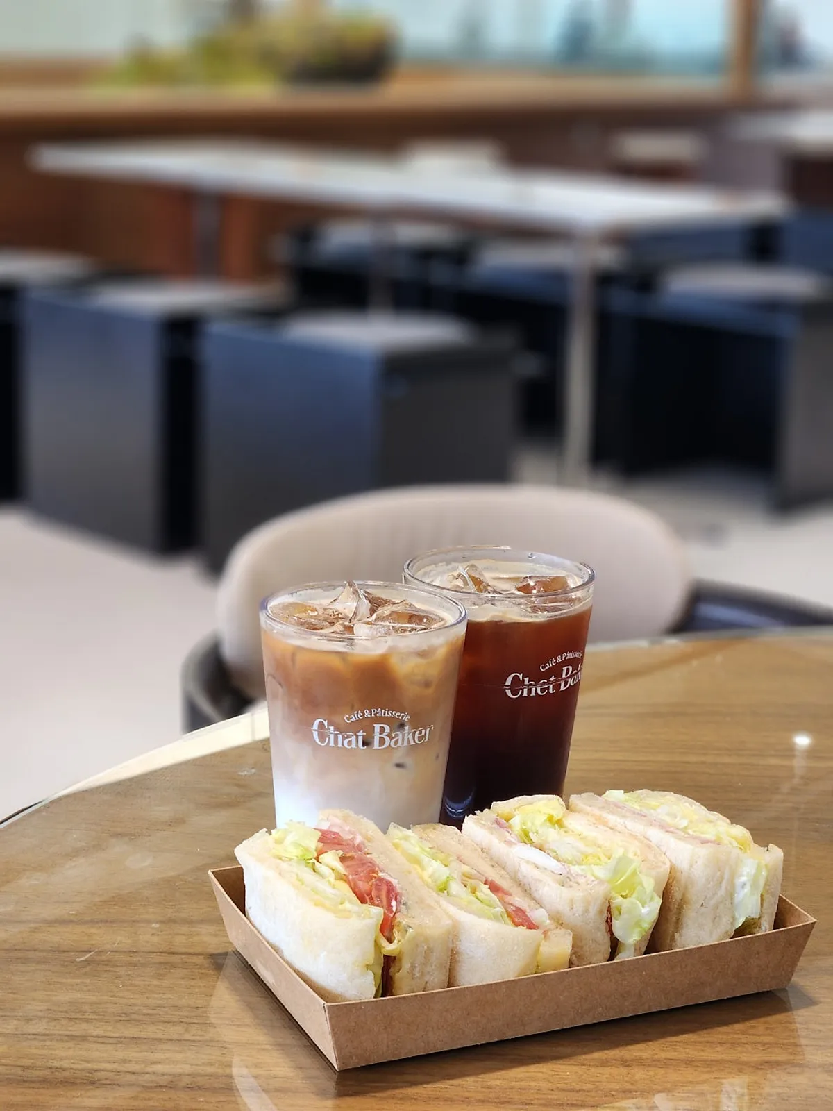 Ciabatta sandwich and iced coffee brunch spread