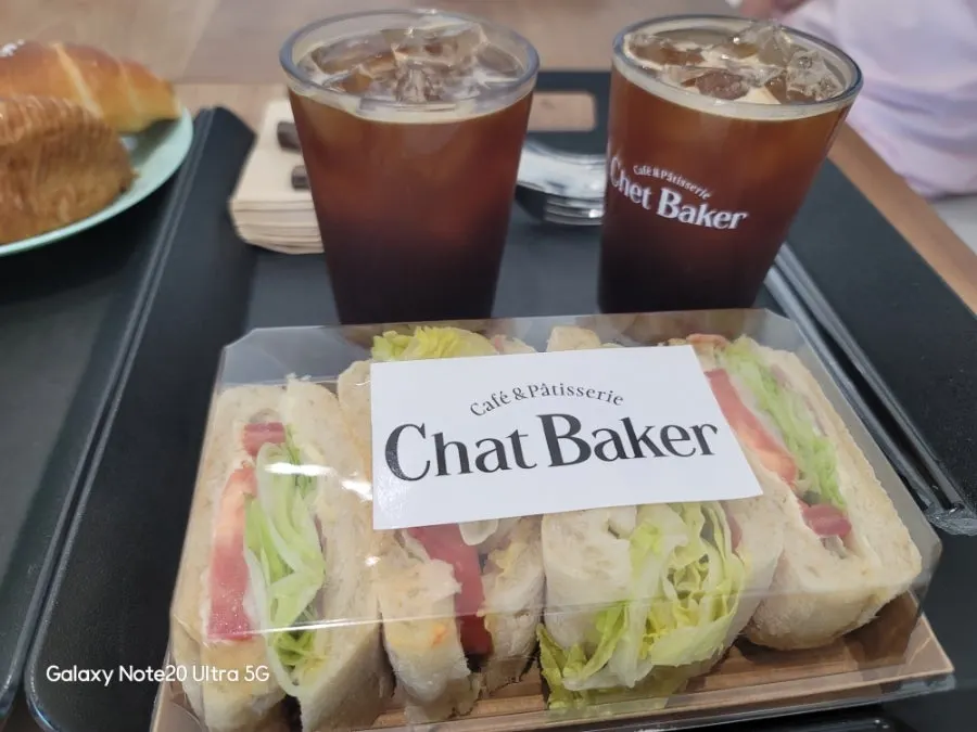 Pizza ciabatta sandwich and iced Americano