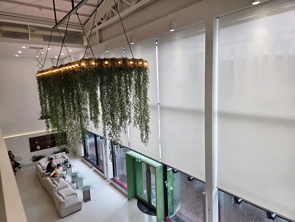 Chat Baker interior with high ceilings and floor-to-ceiling windows