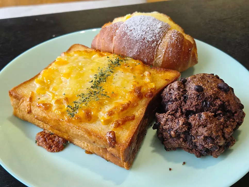 Plate of condensed milk cream salt bread and chocolate scone