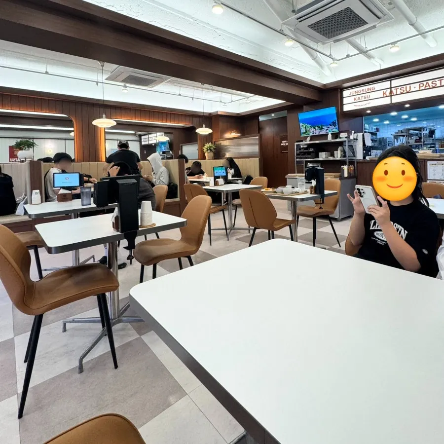 Dining hall seating and aisle at Jeongseong Katsu Chuncheon Hyoja Branch