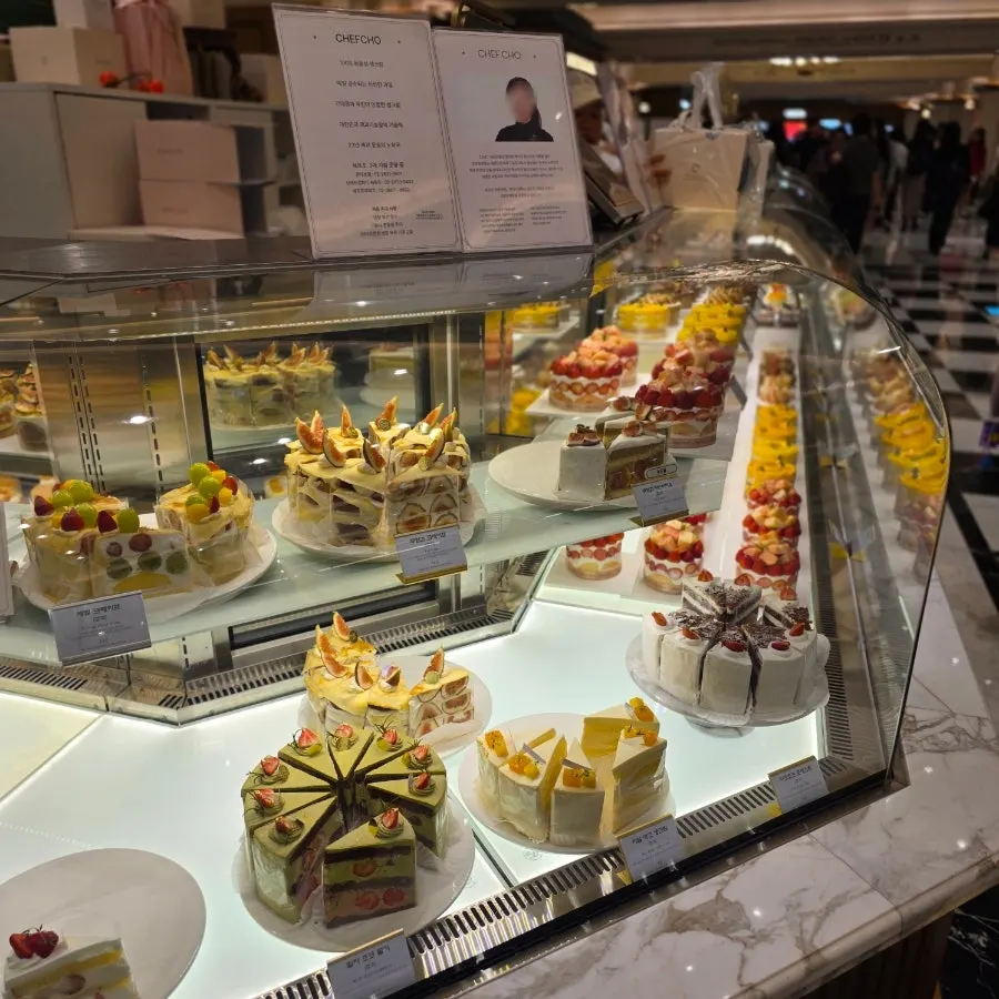 Fresh fruit cakes displayed inside Chef Cho