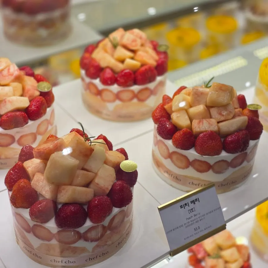 Seasonal fruit whole cakes arranged in the display case