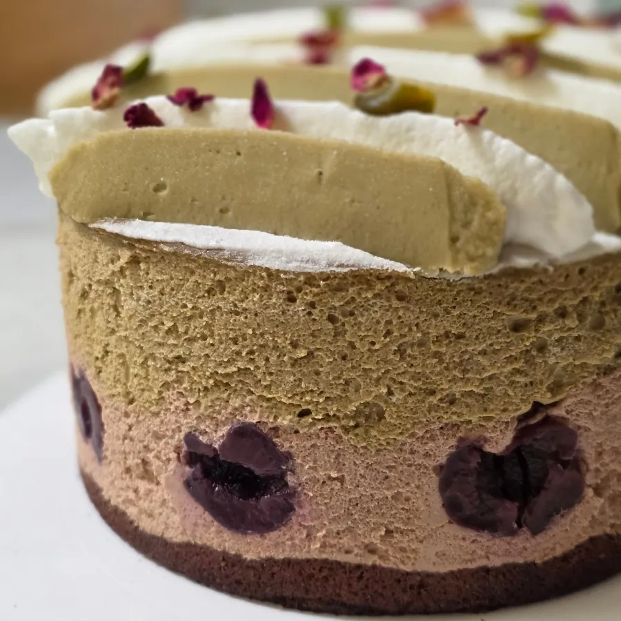 Pistachio forest cake with luxuriously piped cream