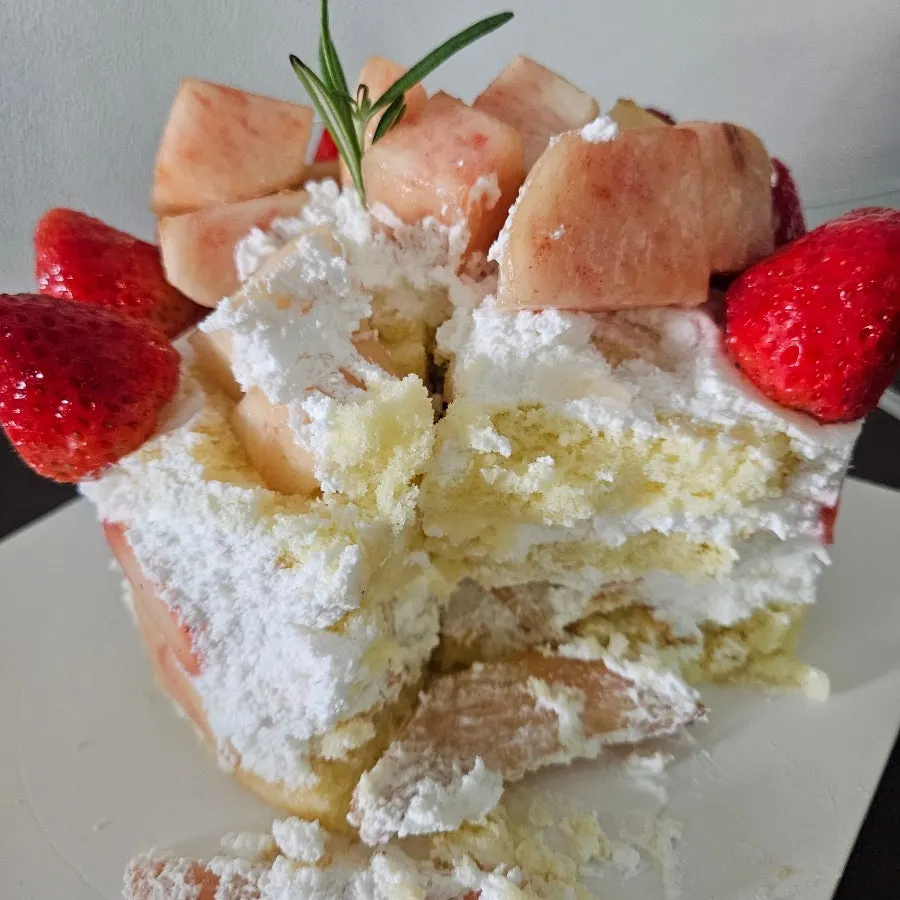 Chef Cho Peach Berry cream cake scooped with a fork