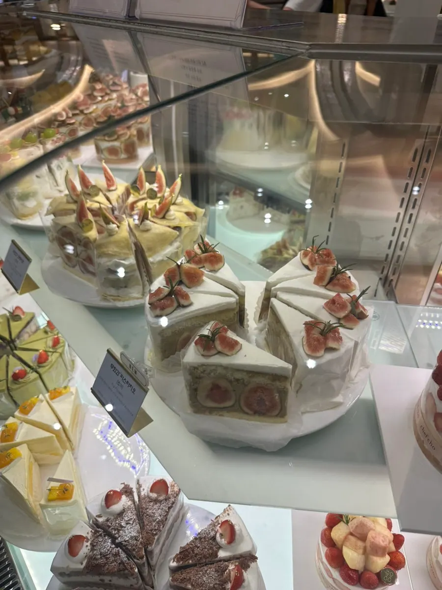 Slice cakes in Chef Cho's display case