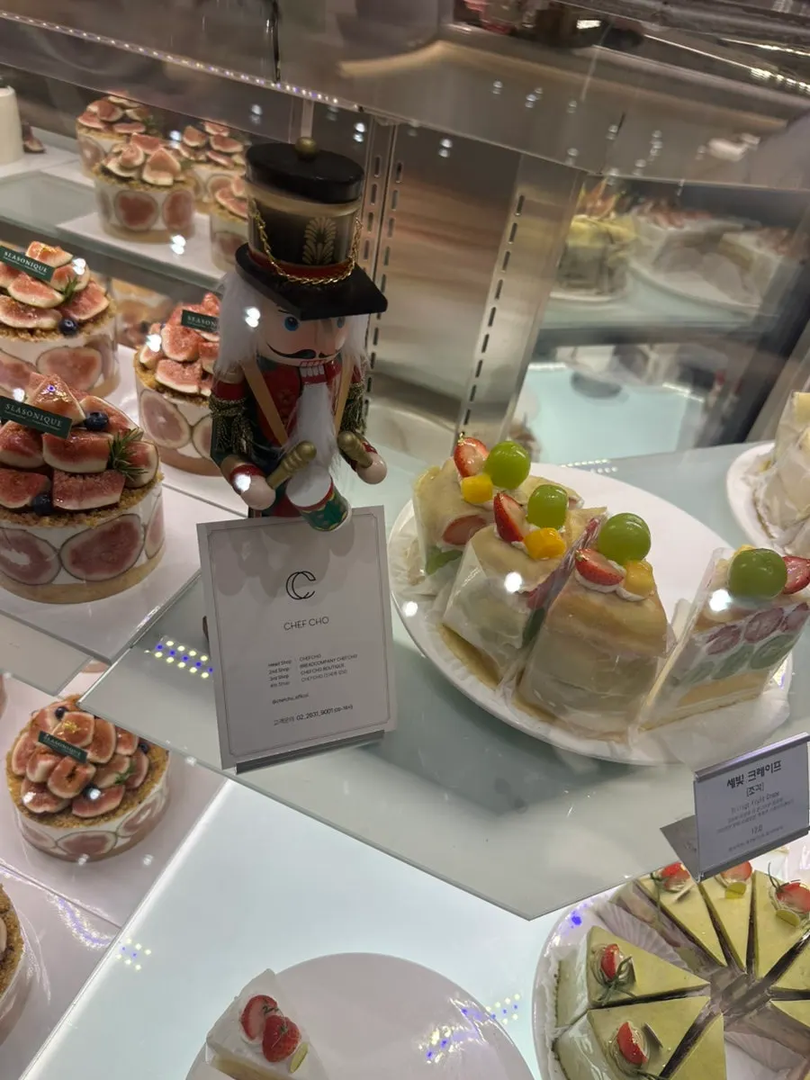 Various cakes in Chef Cho's dessert display case