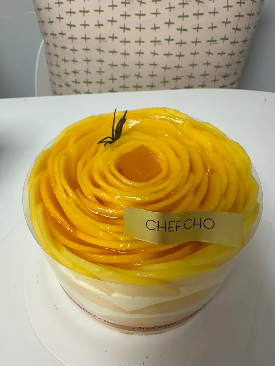 Chef Cho signature mango cake with the box opened