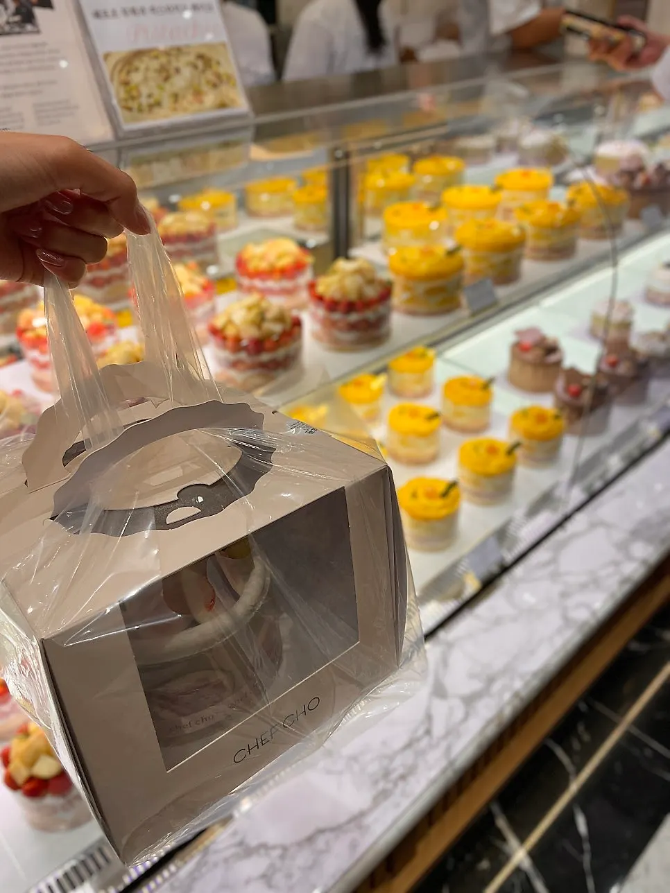 Neatly packaged Chef Cho cake box, picked up later