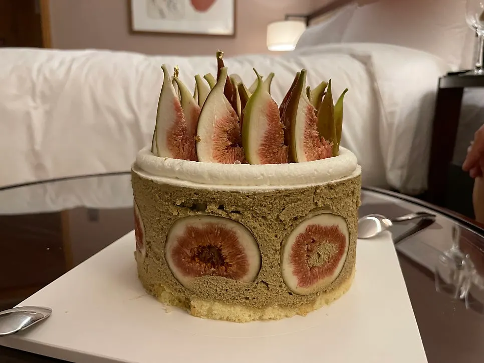 Side view of the unwrapped fig pistachio cake