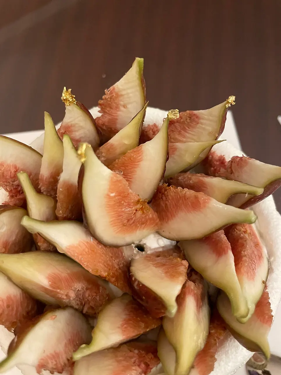 Close-up of the cake top densely covered in figs