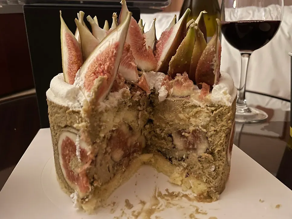 A sliced piece of the fig pistachio cake