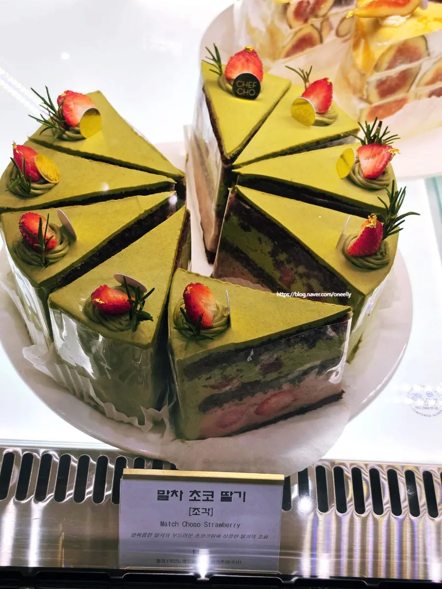 Mango cake selected in front of the showcase