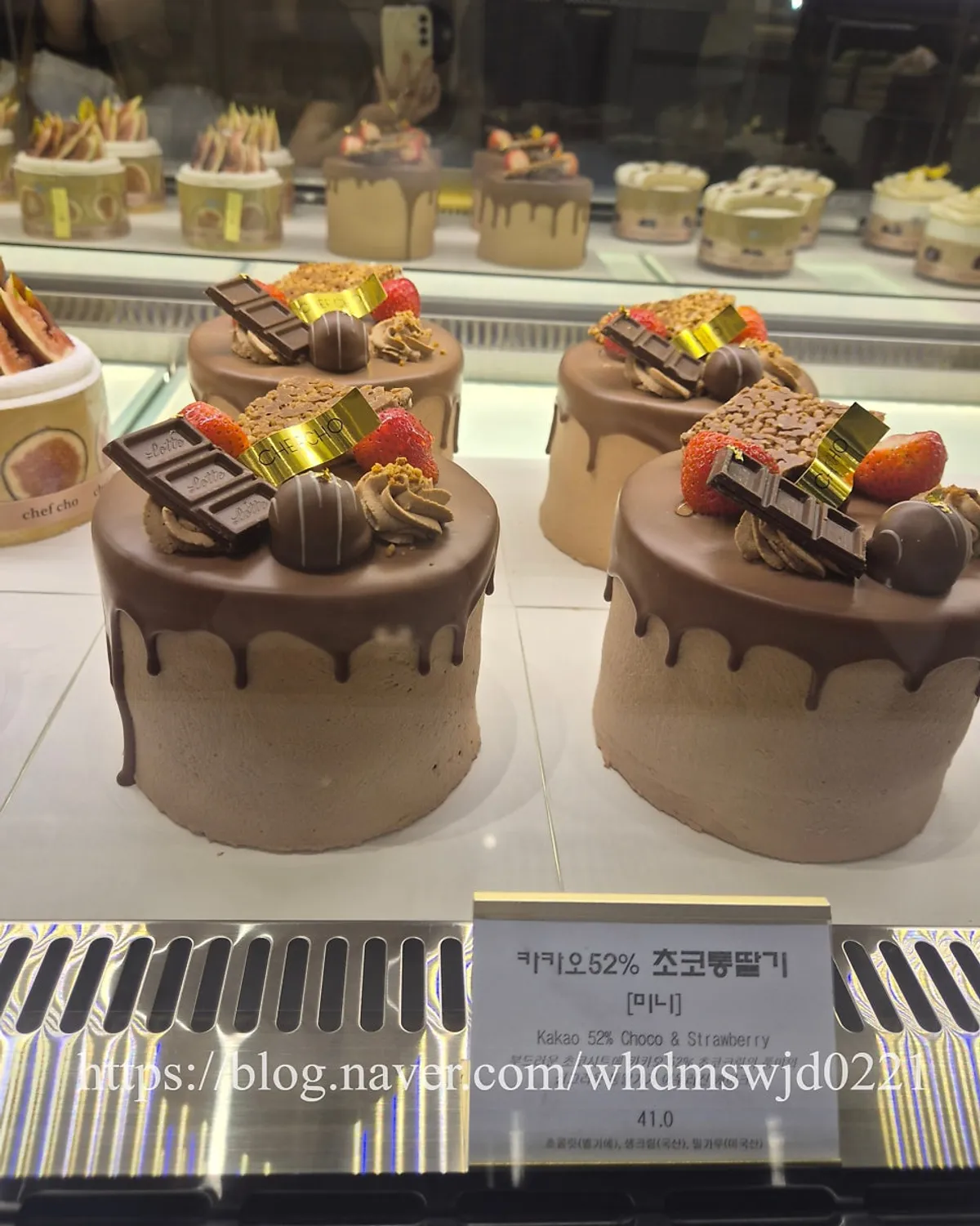 Vertical shot of Chef Cho fruit cream whole cakes on display