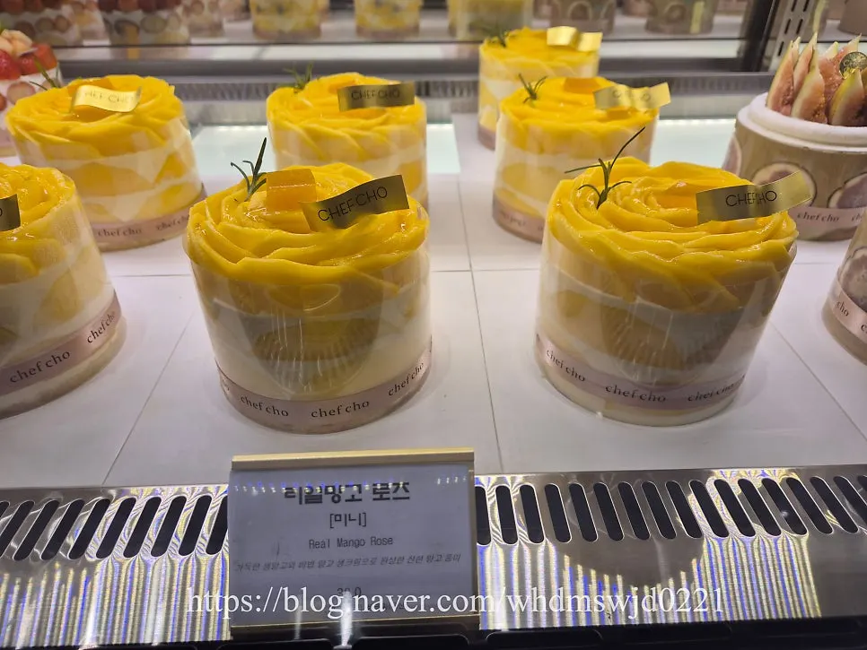 Chef Cho seasonal fruit cakes including strawberry-peach and mango on display