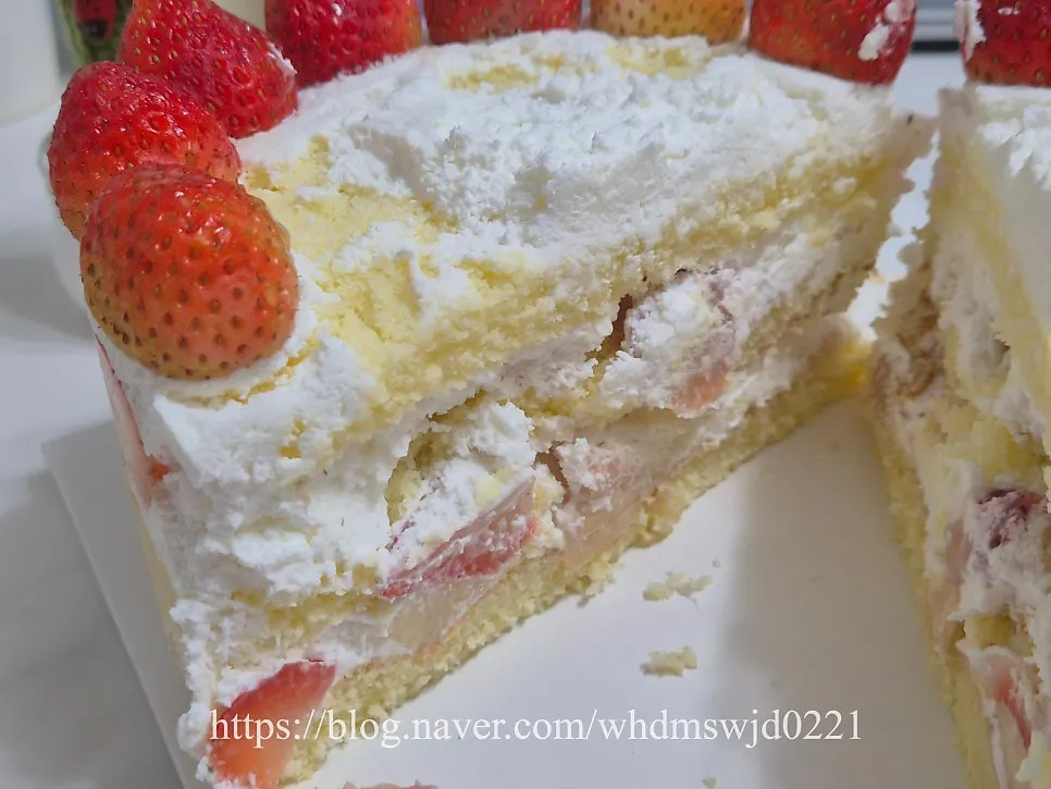 Cross-section of the Peach Berry cake packed with peaches and strawberries
