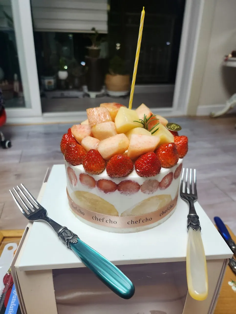 Fruit decoration on top of the peach berry cake