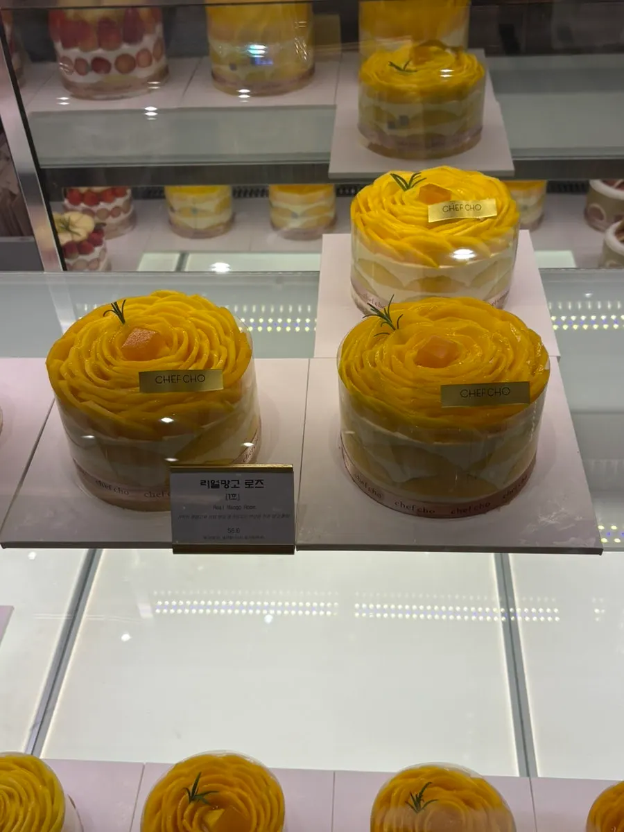 Real Mango Rose whole cake inside the showcase