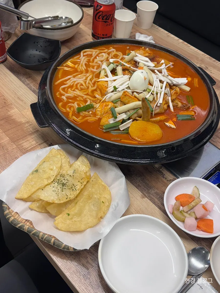 Whole chicken dakdoritang on a cauldron lid
