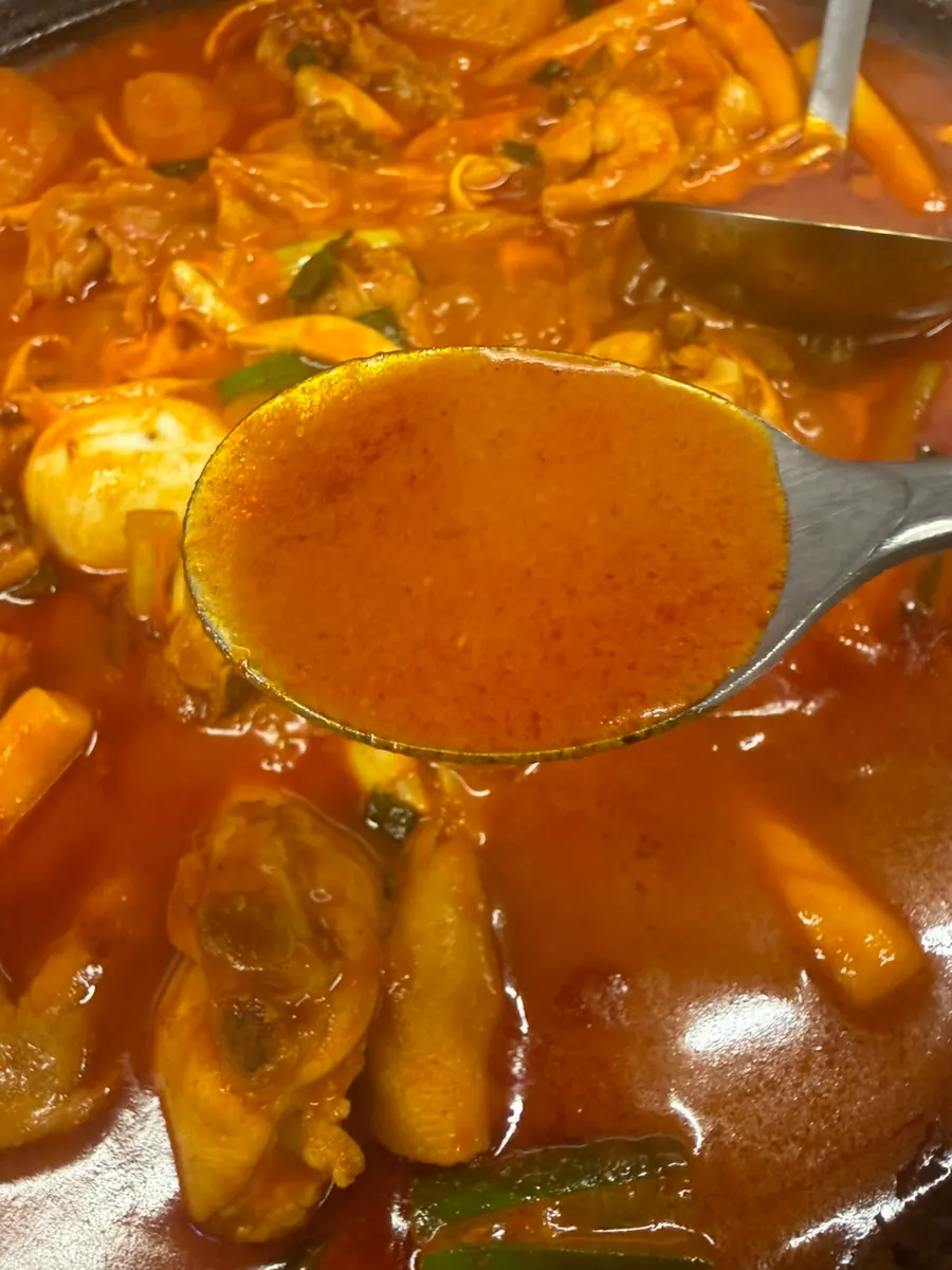 Large pieces of chicken in the chicken stew