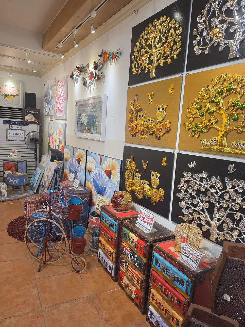 A variety of paintings displayed on the wall