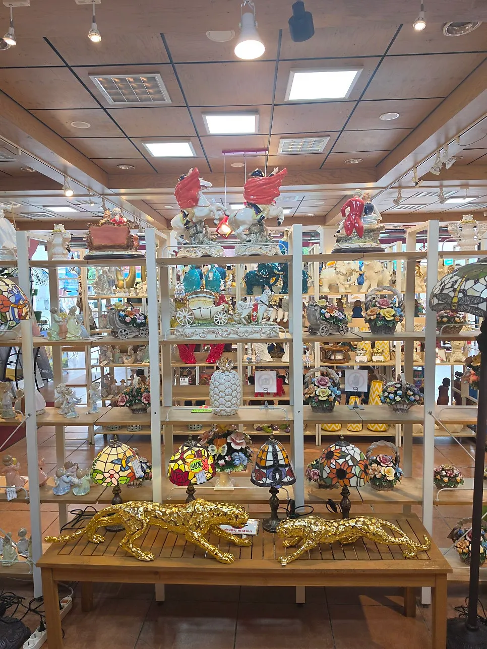 A shelf of direct-imported curated décor items
