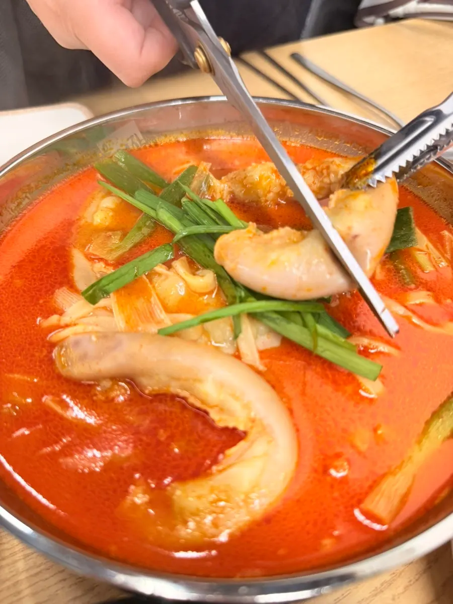 Broth and beef intestines in Gopchang Wangchang Saengyuk Kalmyeon