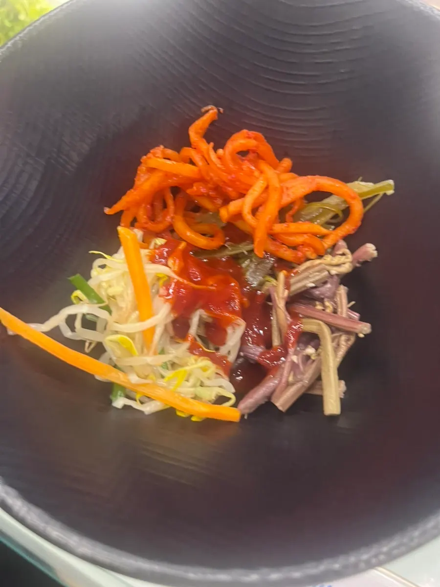 Bibimbap mixed with sesame oil and gochujang