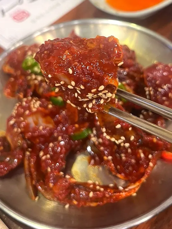 Close-up of the sauce-soaked Jeju yellow crab marinated crab