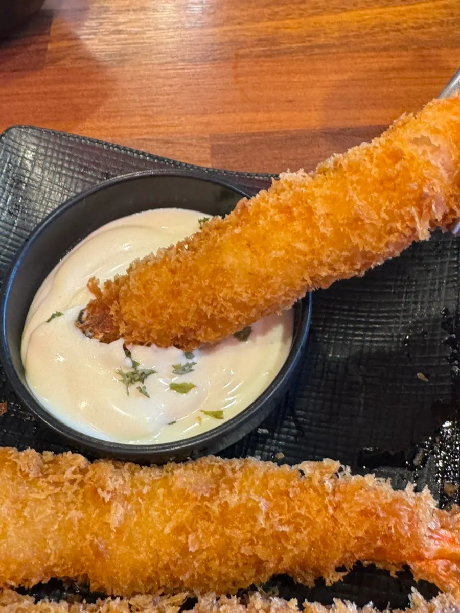 Four freshly fried giant shrimp tempura