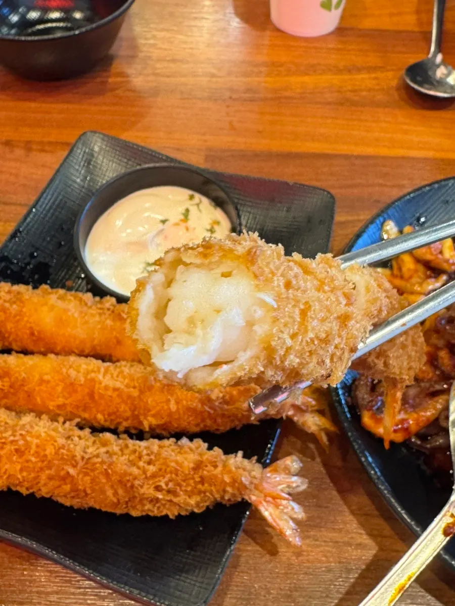 Shrimp tempura dipped in tartar sauce