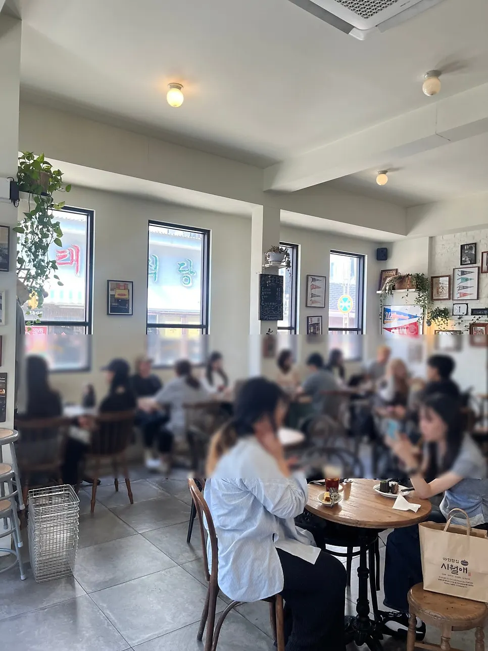 Café interior nearly full on a weekday afternoon
