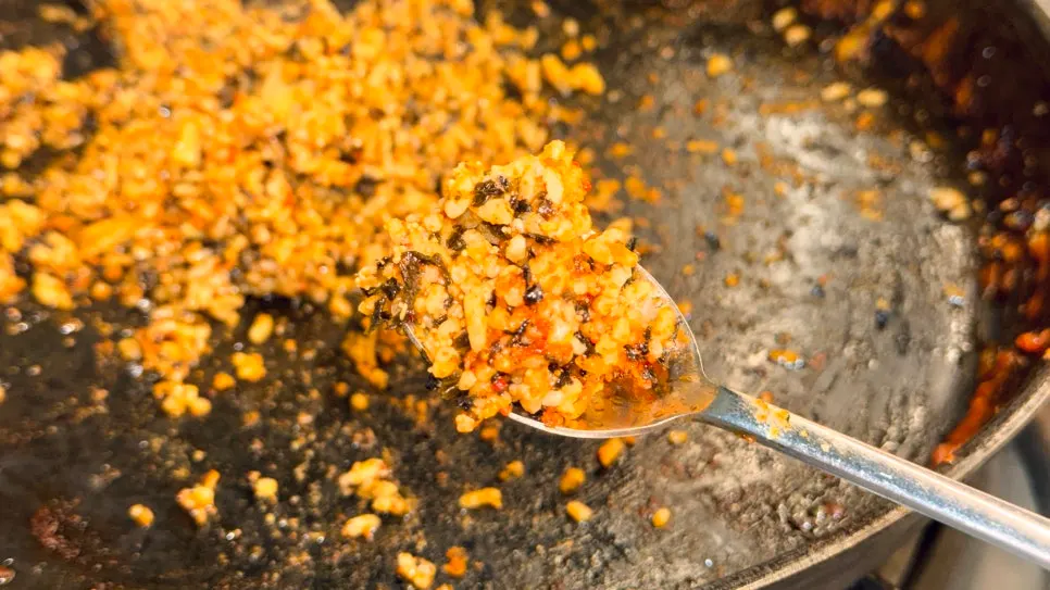 Flying fish roe fried rice spread out on the pan