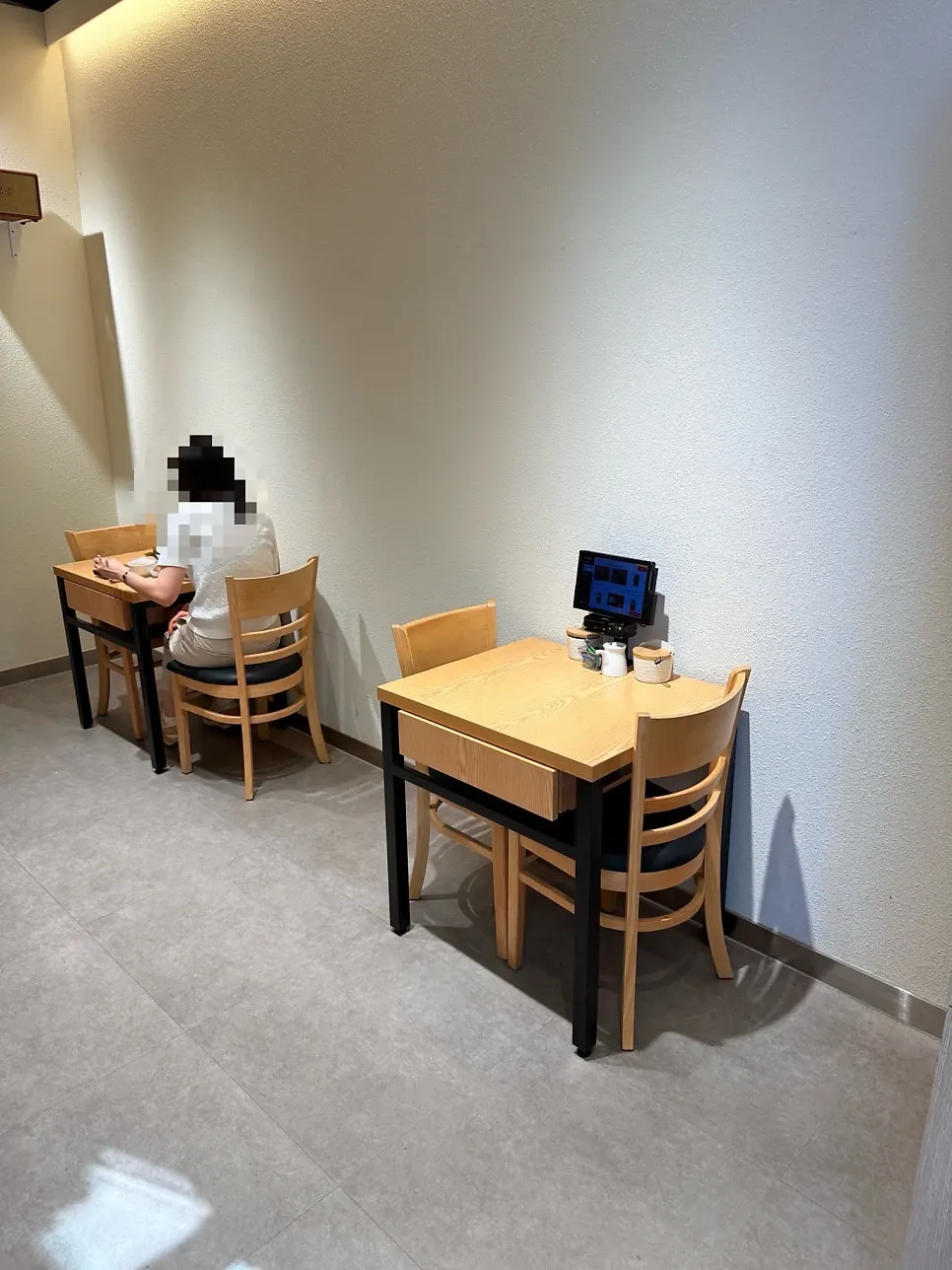 Wall-side seating for solo diners at Ganghan Sushi
