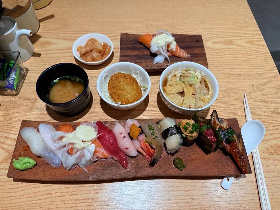 Full spread of omakase sushi and salmon sushi