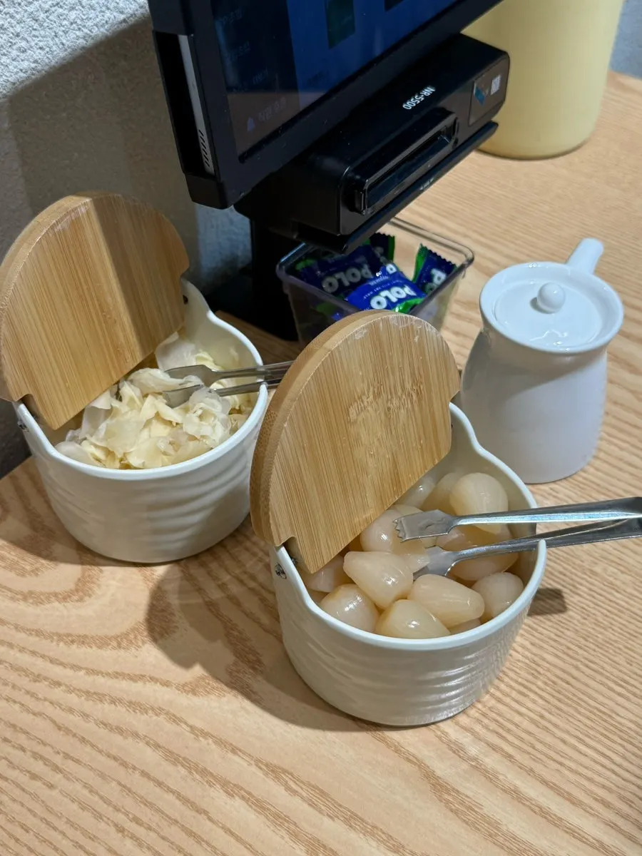 Ginger, rakkyo, and soy sauce set on the table