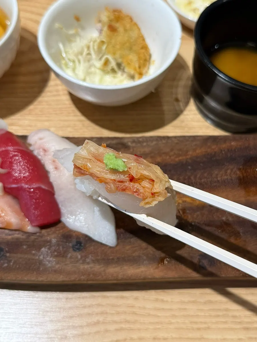 A late-arriving piece of hanchi (squid) sushi