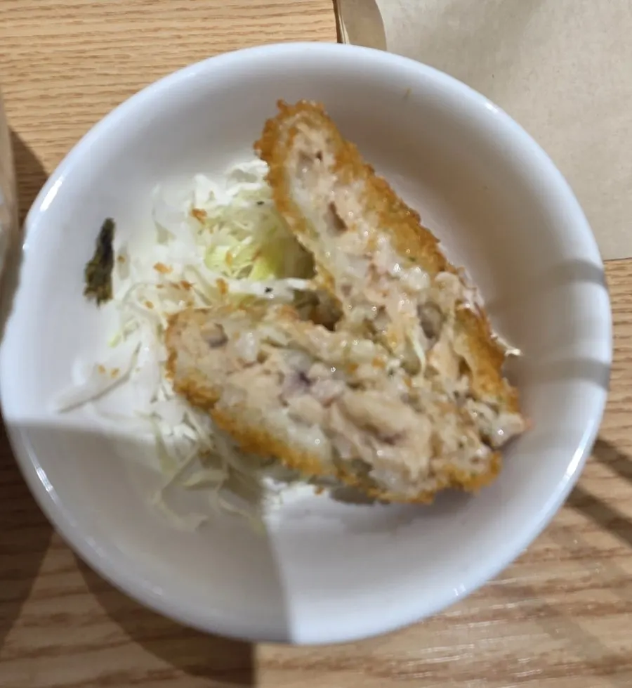 Seafood croquette served with shredded cabbage