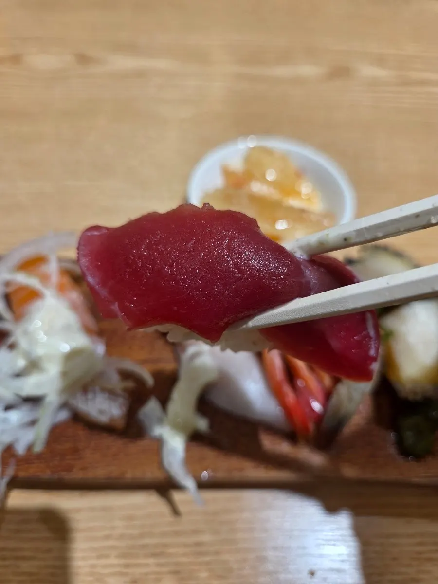 Close-up of sushi with fish generously covering the rice
