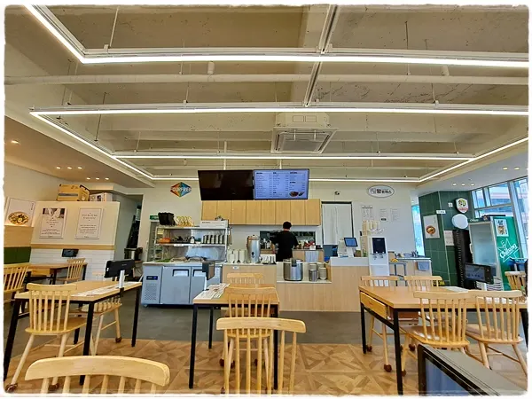 Bright restaurant interior with full-height windows