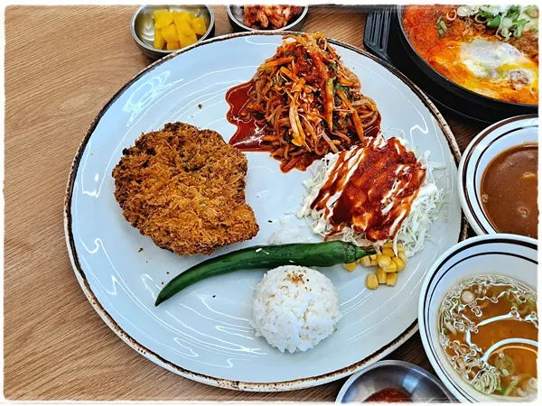 Jinsim Jjol Donkatsu with pork cutlet and chewy spicy noodles
