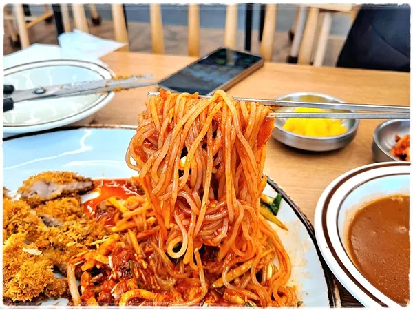 Chewy spicy noodles with tangy, spicy sauce