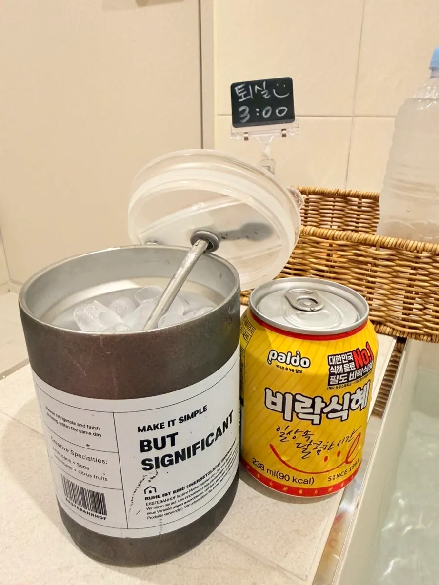 Chilled sikhye poured over ice in a cup