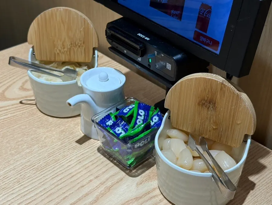 Neatly arranged restaurant table and palate-cleansing candy