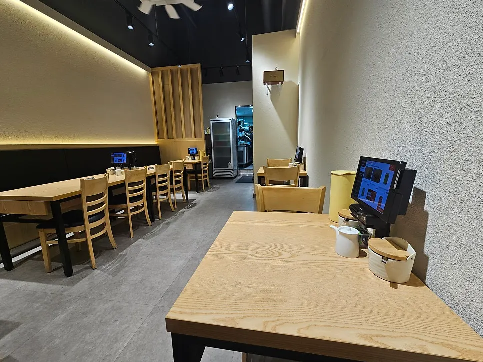 Sushi restaurant interior decorated in wood tones