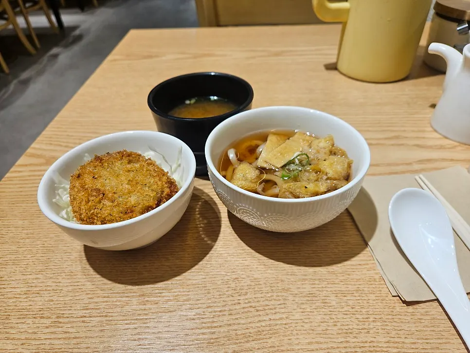 Sushi meal served with udon and croquettes